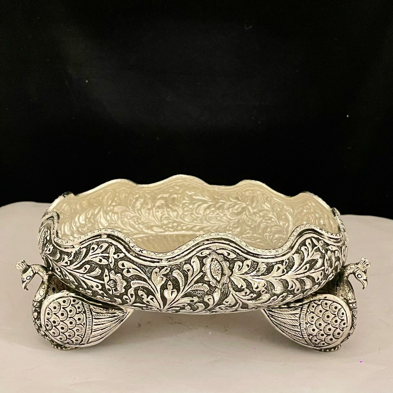 German silver fully carved with peacock legs urli bowl